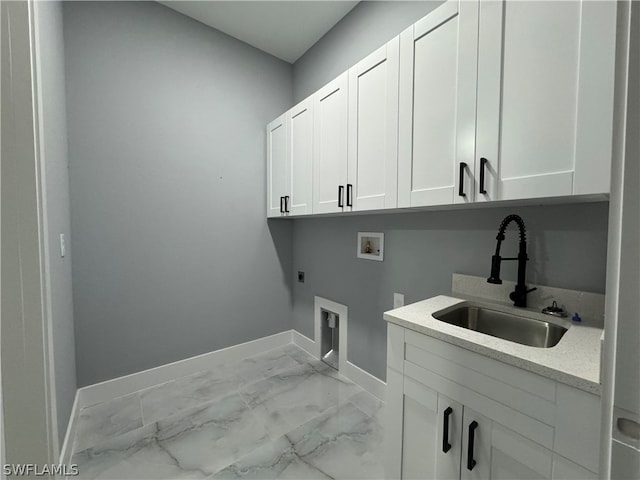 laundry area with cabinets, hookup for a washing machine, electric dryer hookup, sink, and light tile flooring