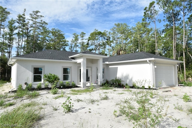 prairie-style house featuring a garage