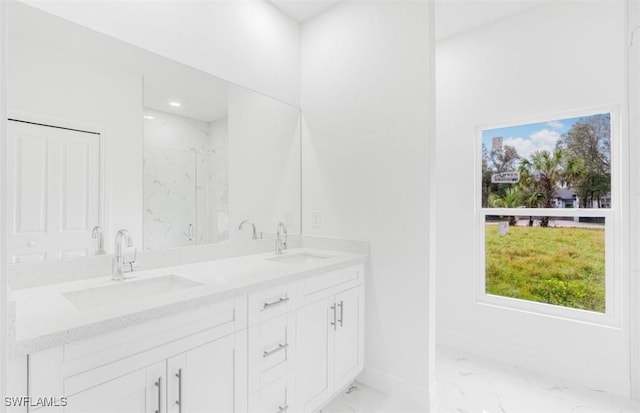 bathroom featuring vanity and an enclosed shower