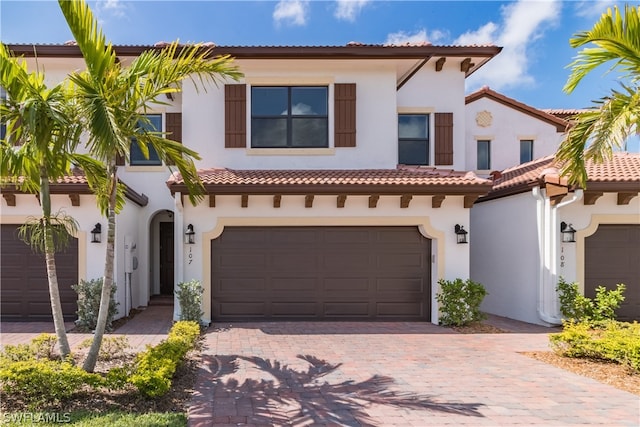 mediterranean / spanish house featuring a garage