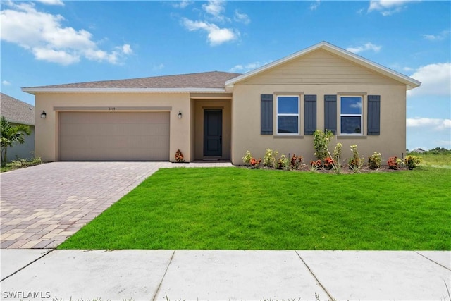 view of front of house with a front lawn and a garage