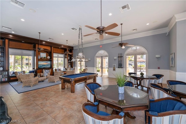 rec room with french doors, pool table, ornamental molding, and light tile patterned floors