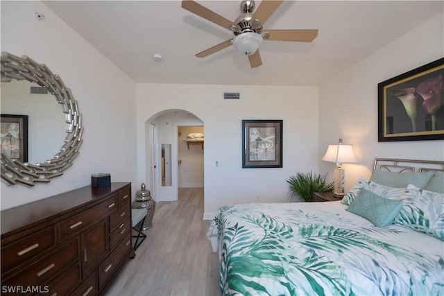 bedroom with light wood-type flooring and ceiling fan