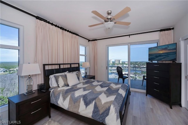 bedroom with a ceiling fan, access to outside, and light wood-style flooring