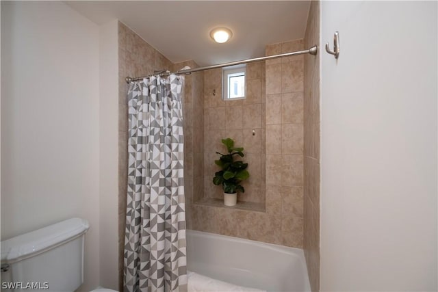 bathroom featuring toilet and shower / bath combo