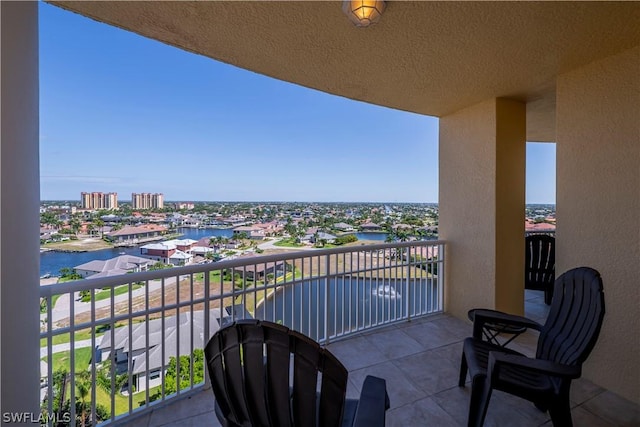 balcony with a view of city and a water view