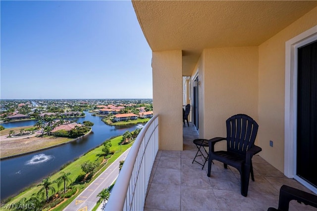 balcony featuring a water view