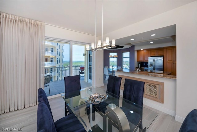 dining space featuring an inviting chandelier