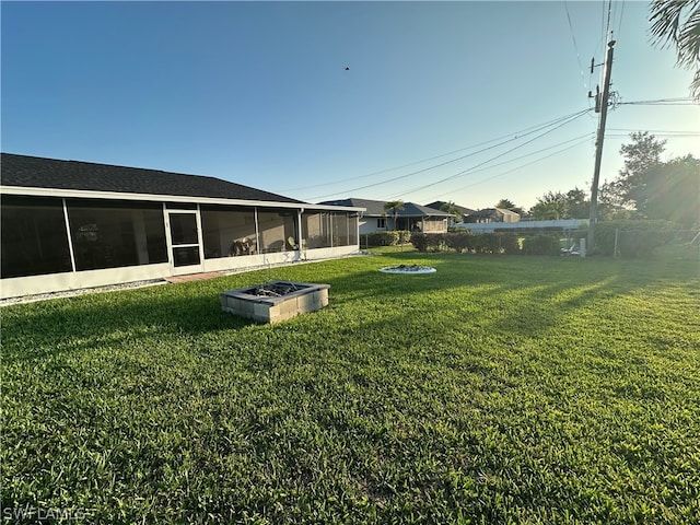 view of yard with a sunroom