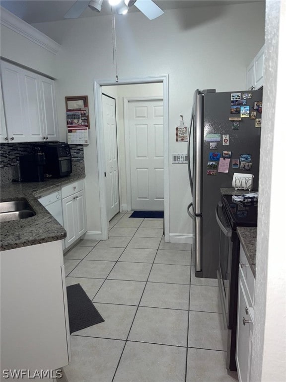 kitchen with white cabinetry, electric range, backsplash, light tile flooring, and ceiling fan