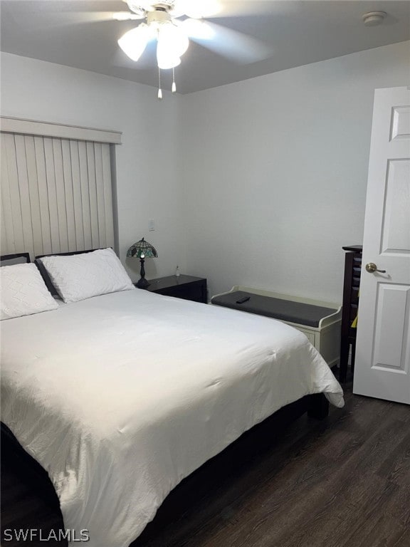 bedroom featuring dark hardwood / wood-style flooring and ceiling fan