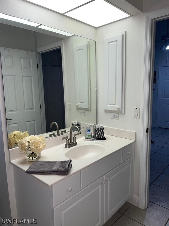 bathroom featuring tile floors and vanity