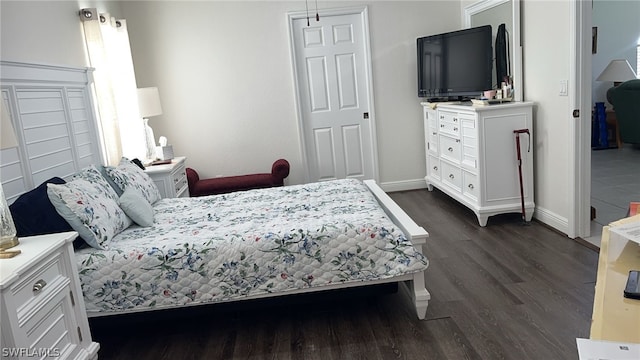 bedroom featuring dark wood-type flooring