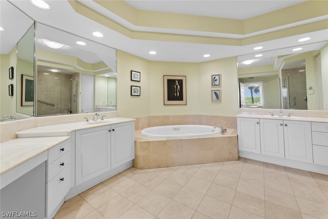 bathroom featuring tile patterned flooring, vanity, and separate shower and tub