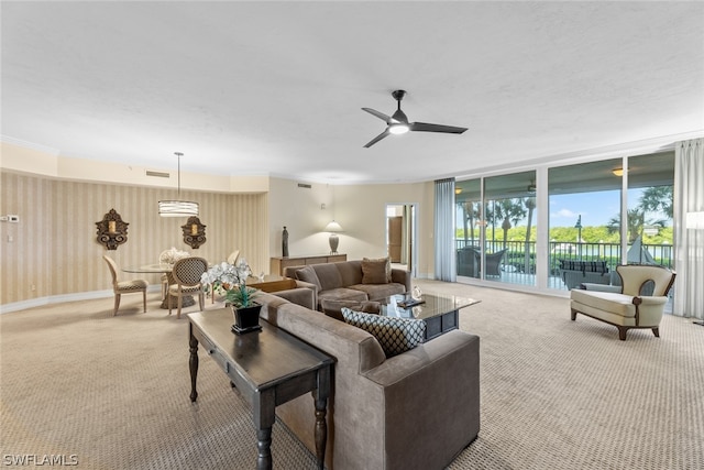 carpeted living room with ceiling fan