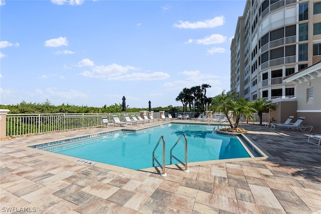 view of swimming pool featuring a patio area