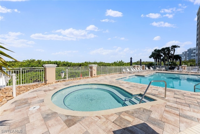 view of swimming pool featuring a patio area