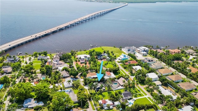 birds eye view of property with a water view and a residential view