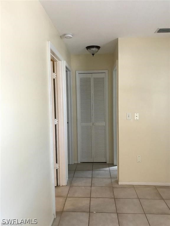 hallway with light tile patterned flooring