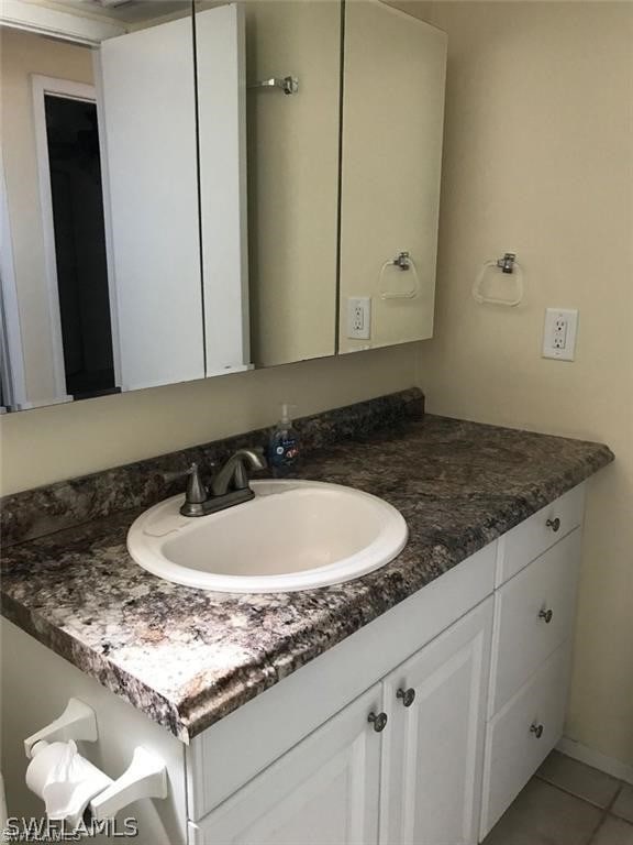 bathroom featuring tile patterned floors and vanity