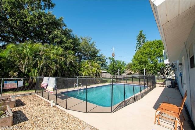 view of pool featuring central air condition unit and a patio