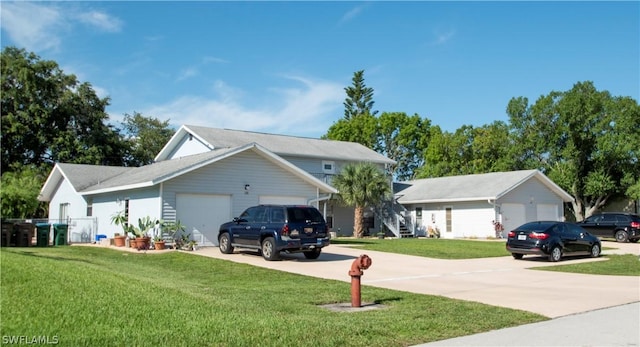 view of front of property featuring a garage and a front yard