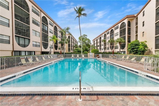 view of swimming pool with a patio area