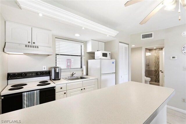 kitchen featuring white cabinetry, sink, ceiling fan, and white appliances