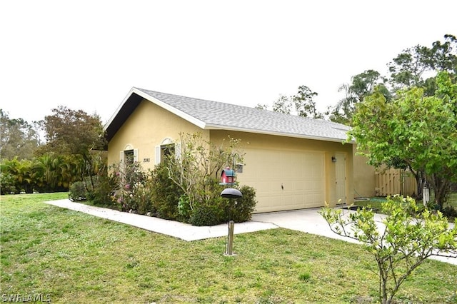 view of home's exterior featuring a garage and a lawn