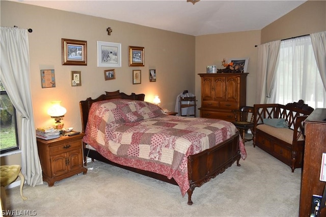 bedroom with light colored carpet