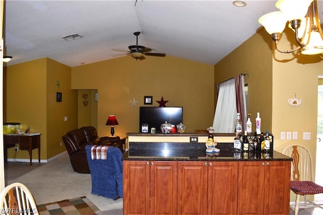 living room with ceiling fan with notable chandelier, lofted ceiling, and light carpet