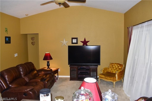 carpeted living room featuring ceiling fan and lofted ceiling