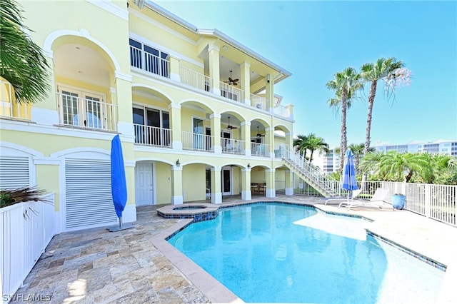 view of pool featuring an in ground hot tub, ceiling fan, and a patio