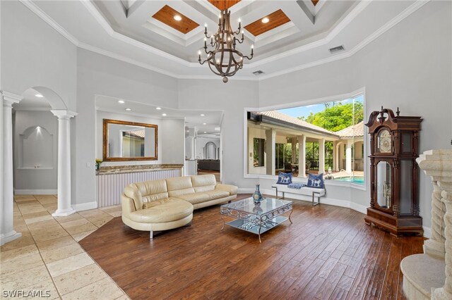 15401 Old Wedgewood Ct, Fort Myers, FL 33908 - living room featuring crown molding, a towering ceiling, coffered ceiling, and ornate columns