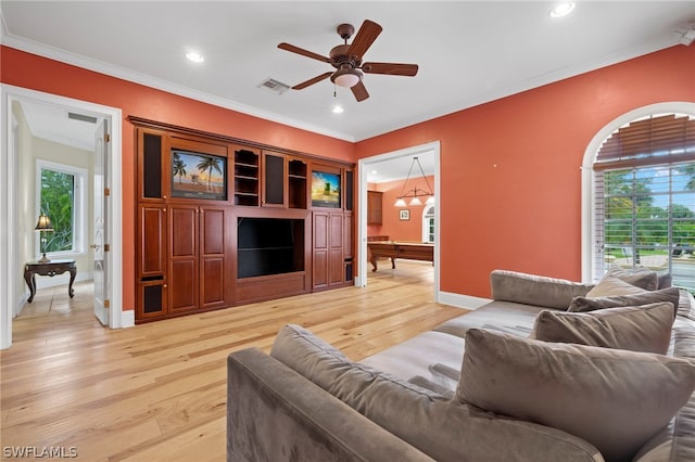 15401 Old Wedgewood Ct, Fort Myers, FL 33908 - living room with ornamental molding, plenty of natural light, ceiling fan, and light hardwood / wood-style floors