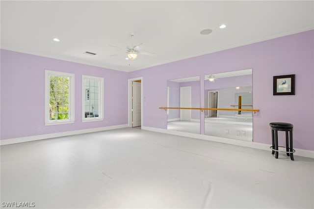 unfurnished room with concrete flooring, ceiling fan, and crown molding