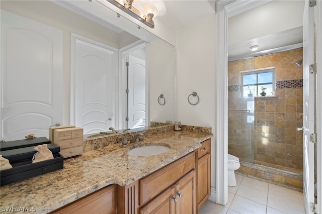 15401 Old Wedgewood Ct, Fort Myers, FL 33908 - bathroom featuring a shower with door, vanity, tile patterned flooring, and toilet