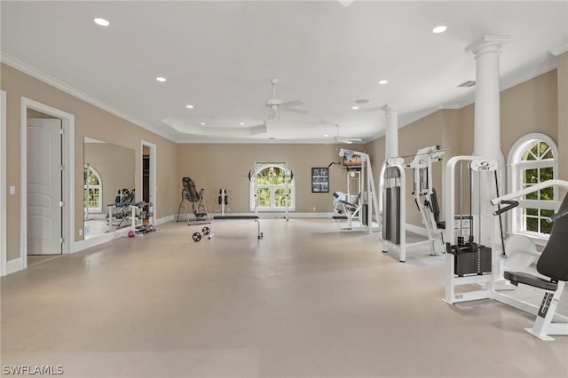 gym featuring ceiling fan, ornamental molding, and decorative columns