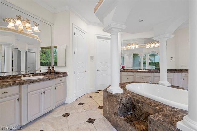 bathroom featuring tile flooring, oversized vanity, ornamental molding, and a bathing tub