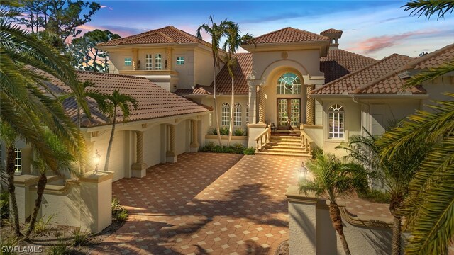 15401 Old Wedgewood Ct, Fort Myers, FL 33908 - back house at dusk with french doors