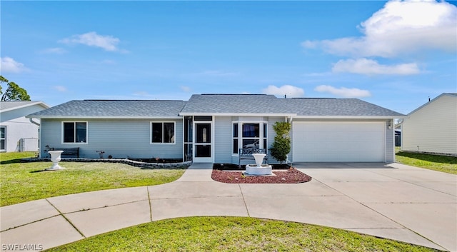 single story home featuring a garage and a front lawn