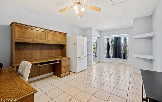 kitchen with a textured ceiling, built in features, white fridge, ceiling fan, and light tile floors