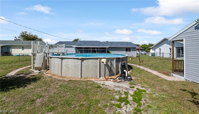 view of pool with a lawn