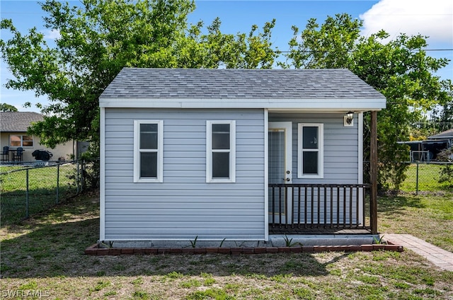 view of outdoor structure with a lawn