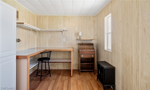 office area featuring built in desk and light hardwood / wood-style flooring