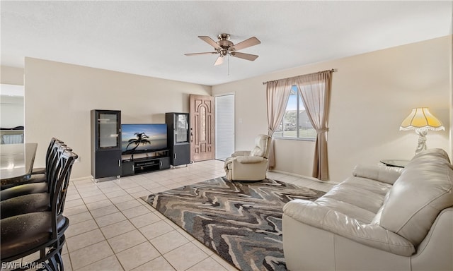 tiled living room featuring ceiling fan