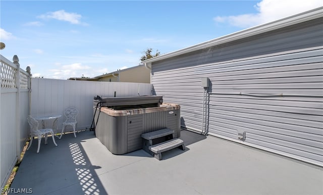 view of terrace featuring a hot tub