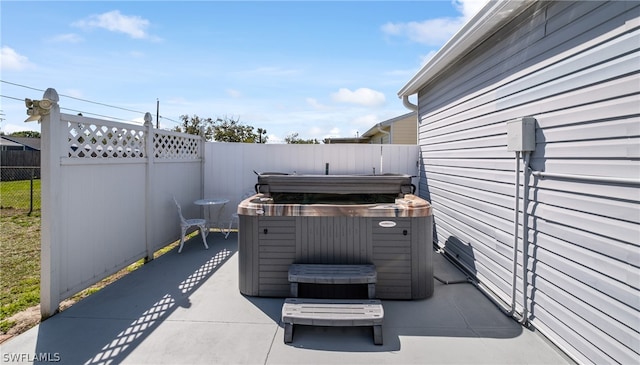 view of patio / terrace featuring a hot tub