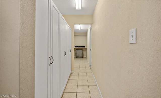 hall featuring light tile floors