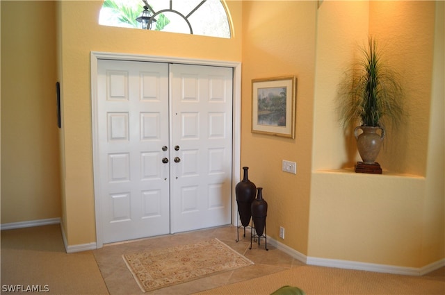 entrance foyer featuring carpet flooring